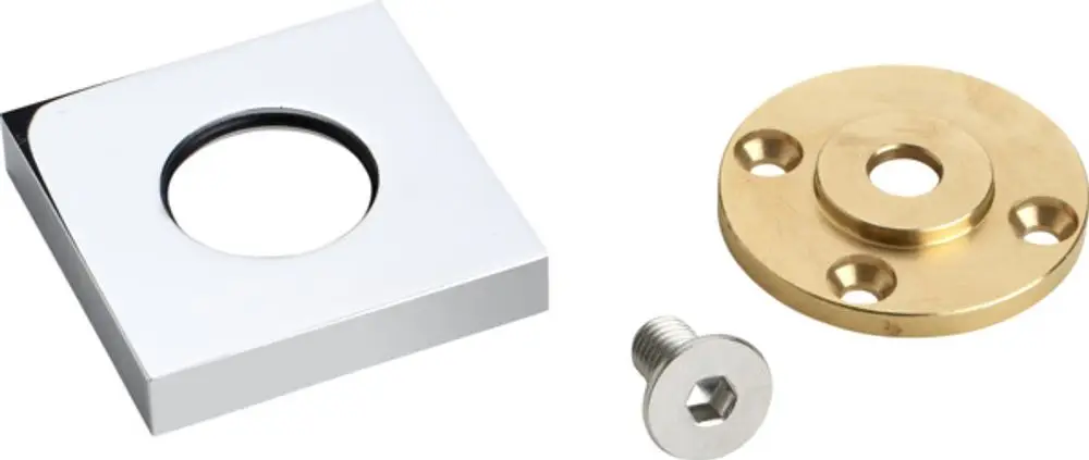 Befestigungsset bestehend aus einem quadratischen, verchromten Deckel, einer runden, goldfarbenen Grundplatte und einer silbernen Schraube. Ideal Standard.